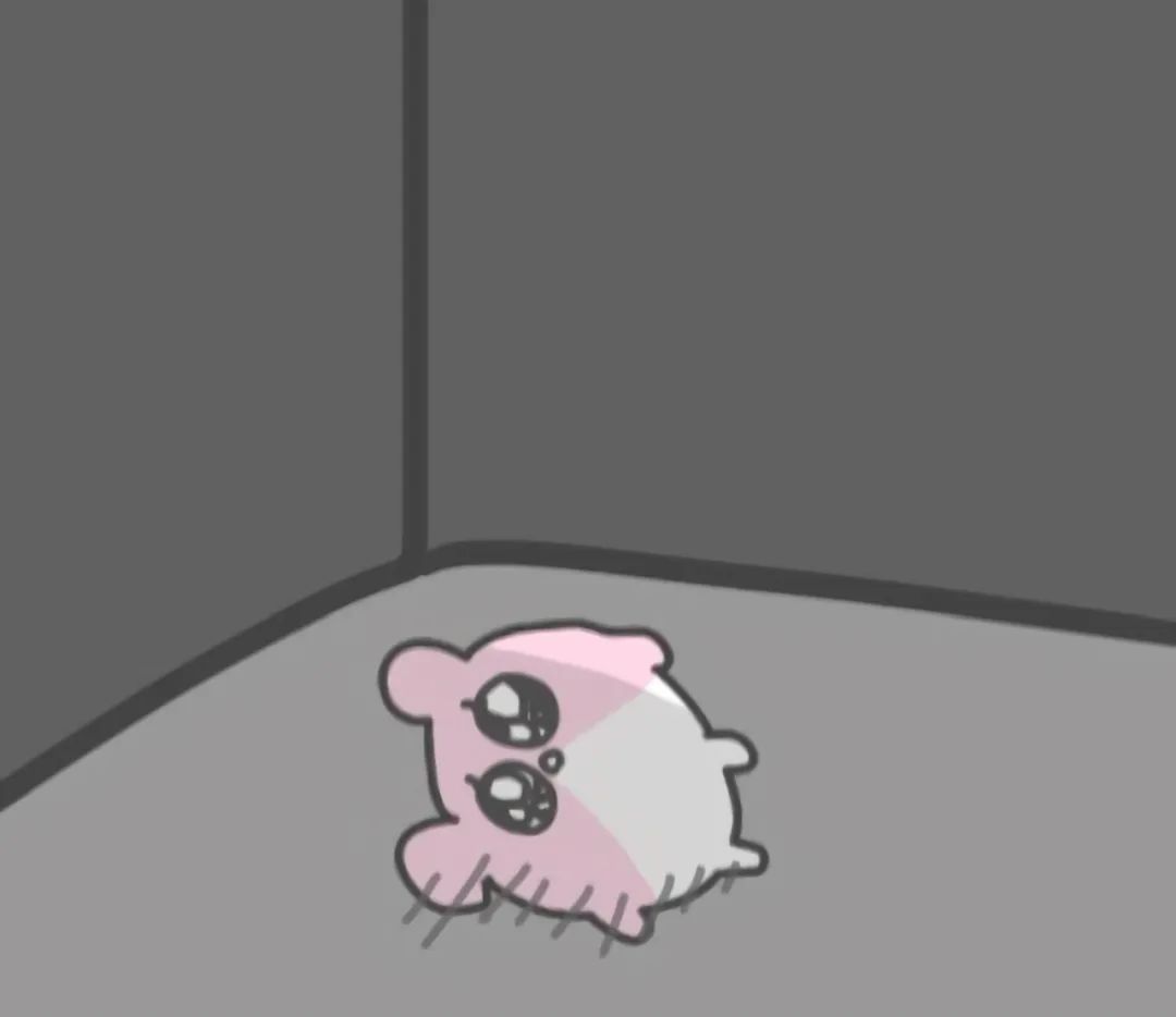 可爱粉色小仓鼠孤零零的躺在地上